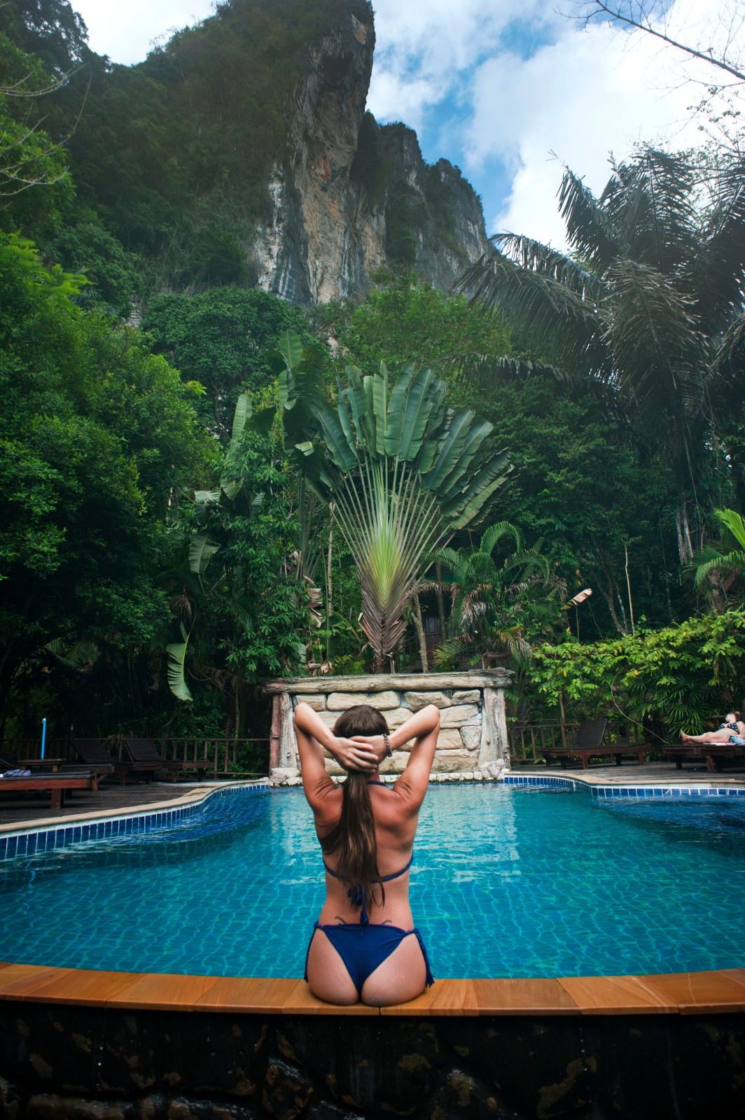 Pool overlooking Bali jungle and a rock formation
