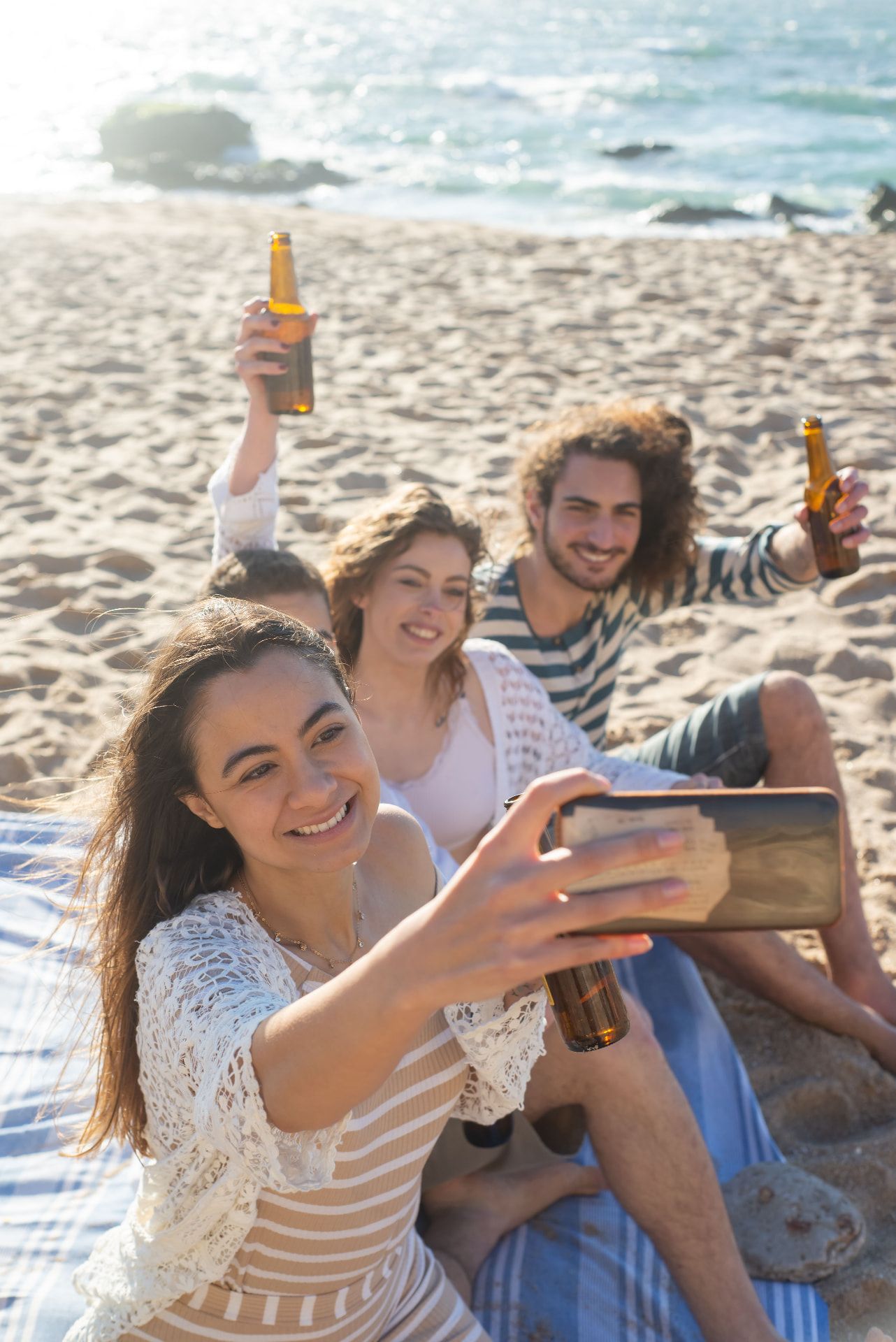 Friends taking a selfie together on a sunny beach