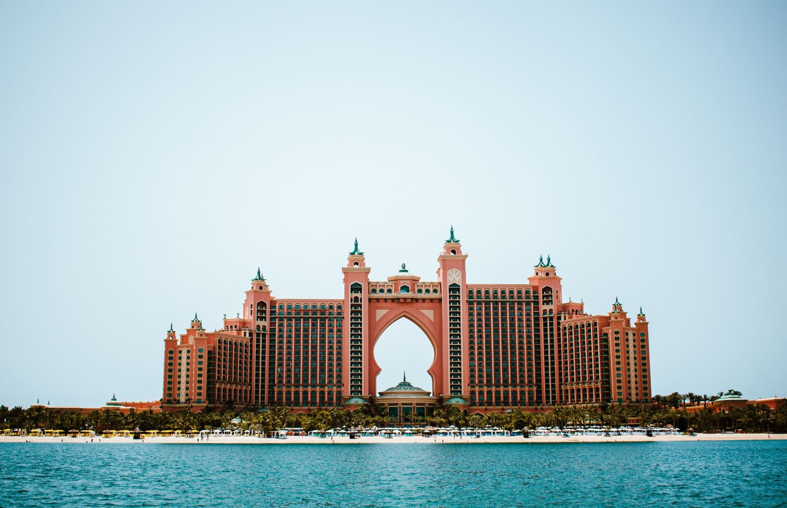 Large beachfront resort in Dubai seen from across calm water